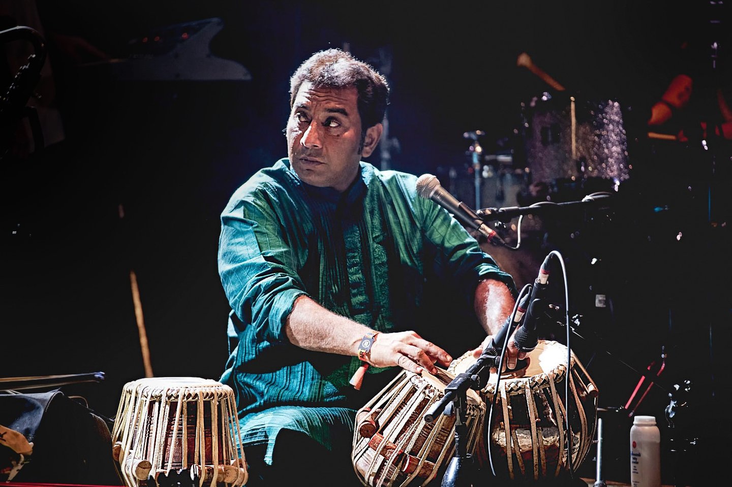 Dani Khan performing tabla on stage